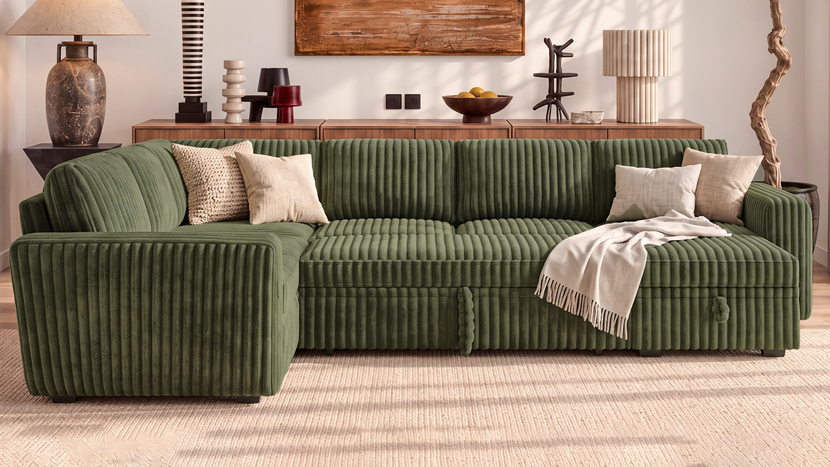 Green wide-rib corduroy modular sectional sofa with chaise, throw blanket, and pillows in a modern living room