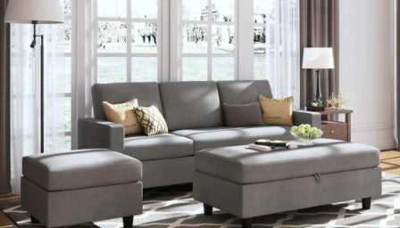 a 4-seater couch with chaise on grey color perfect to warm up a living room 