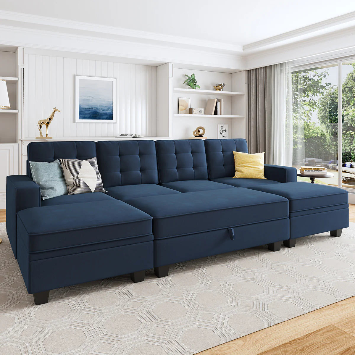 a blue navy colored sleeper sofa in a white designed living room 